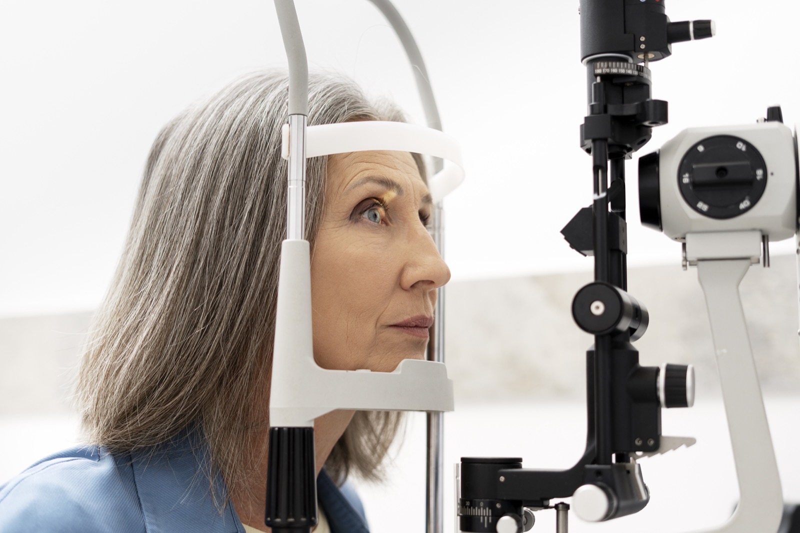 Patient receiving a slit lamp eye exam