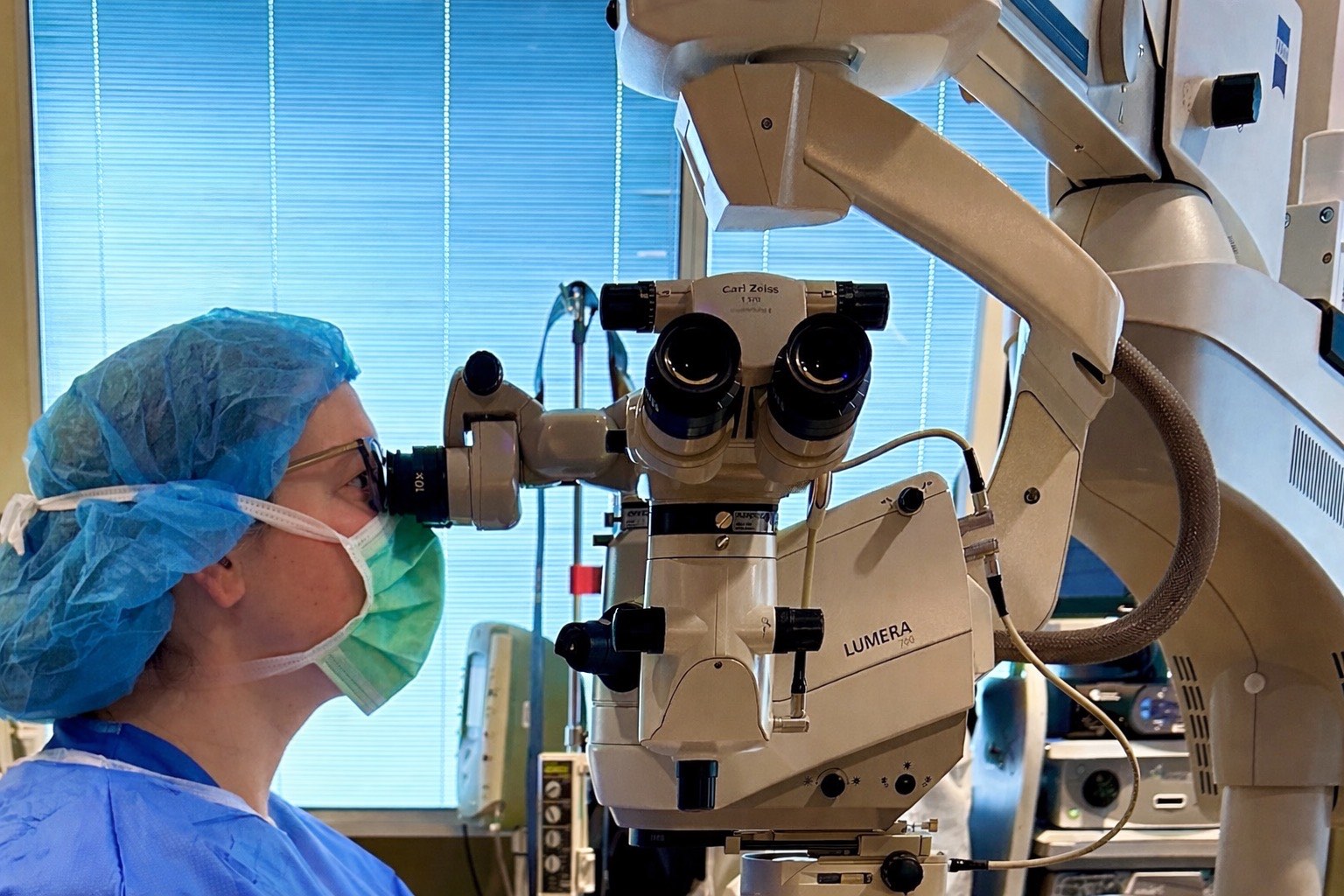 Dr. Dale performing surgery at the operating microscope